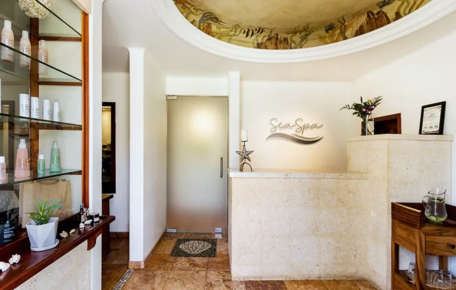 Sea Spa reception beneath a painted sea-life ceiling mural